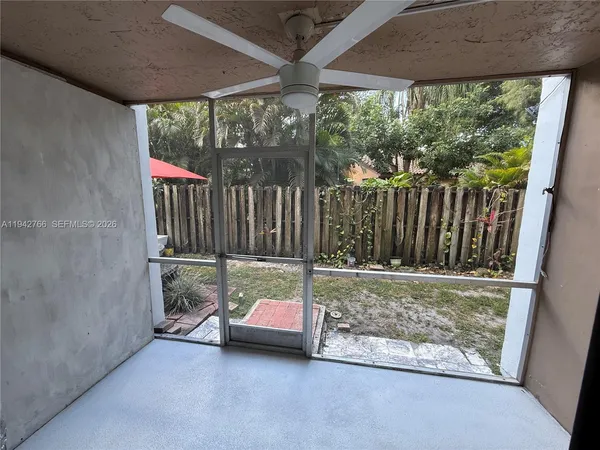 a view of backyard with green space and outdoor seating