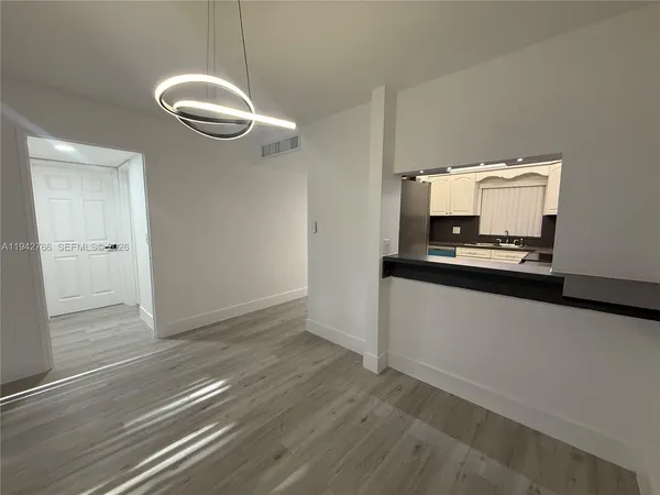 a view of a kitchen with a sink