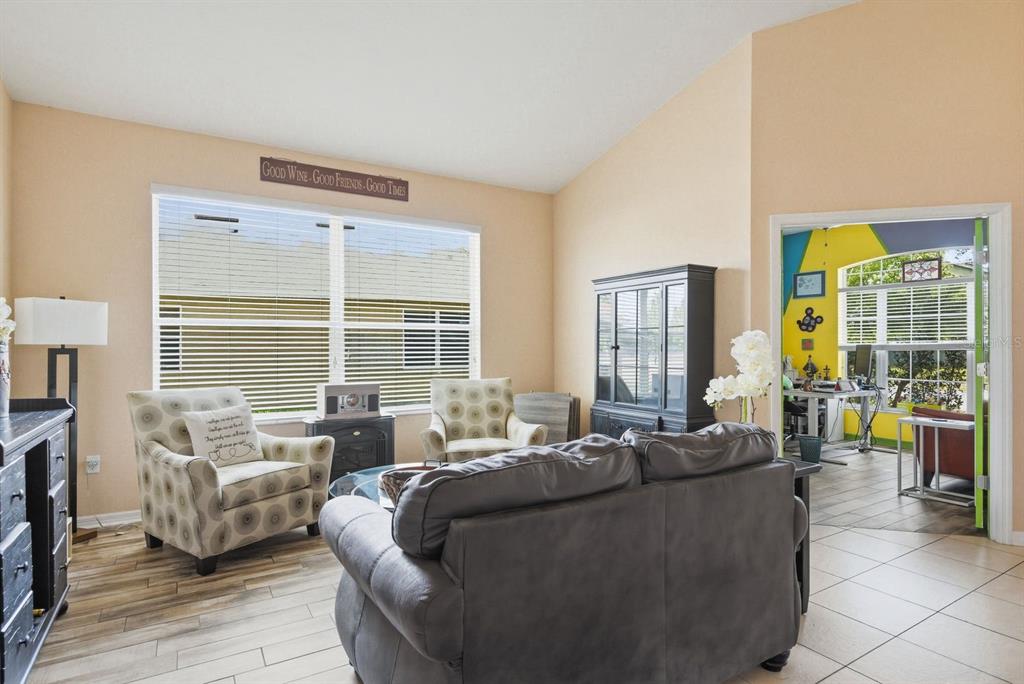 2423 Triggerfish Court Holiday, FL 34691 - Photo 15 of 71 a living room with furniture and large windows