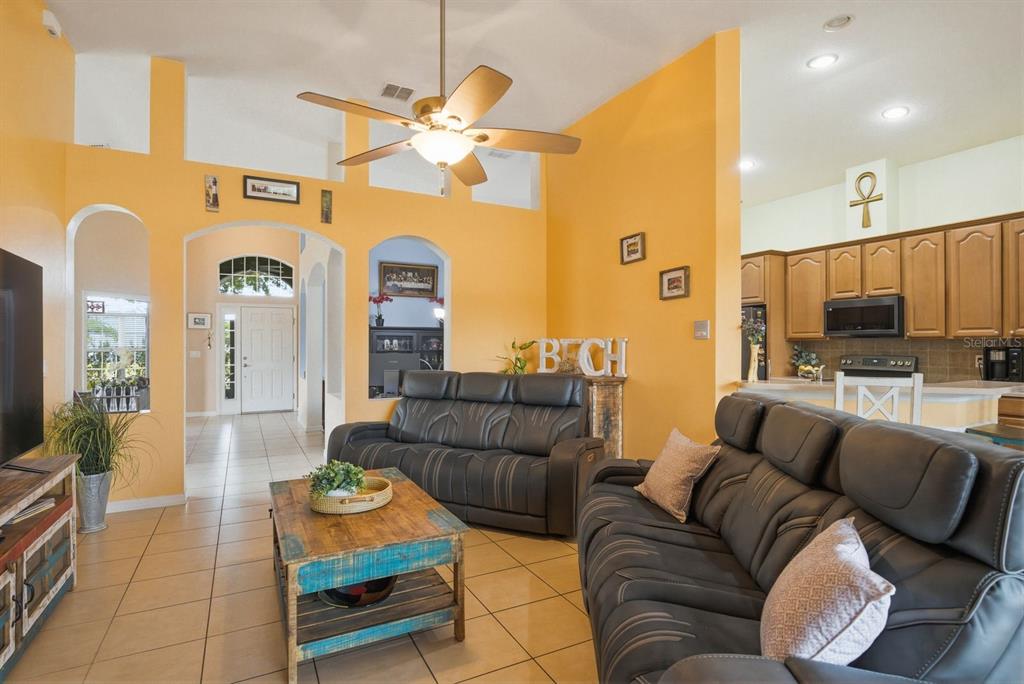 2423 Triggerfish Court Holiday, FL 34691 - Photo 19 of 71 a living room with furniture and a flat screen tv