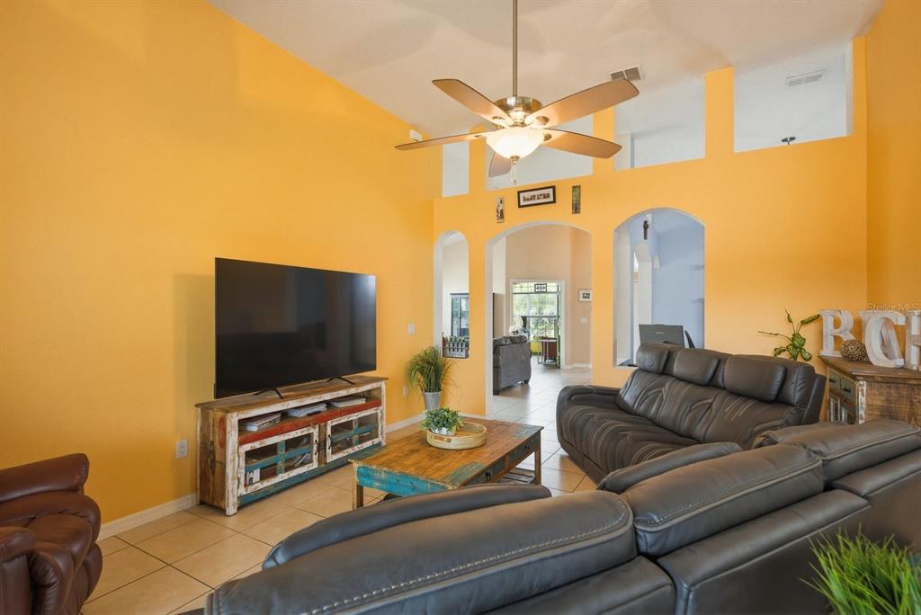 2423 Triggerfish Court Holiday, FL 34691 - Photo 20 of 71 a living room with furniture and a flat screen tv