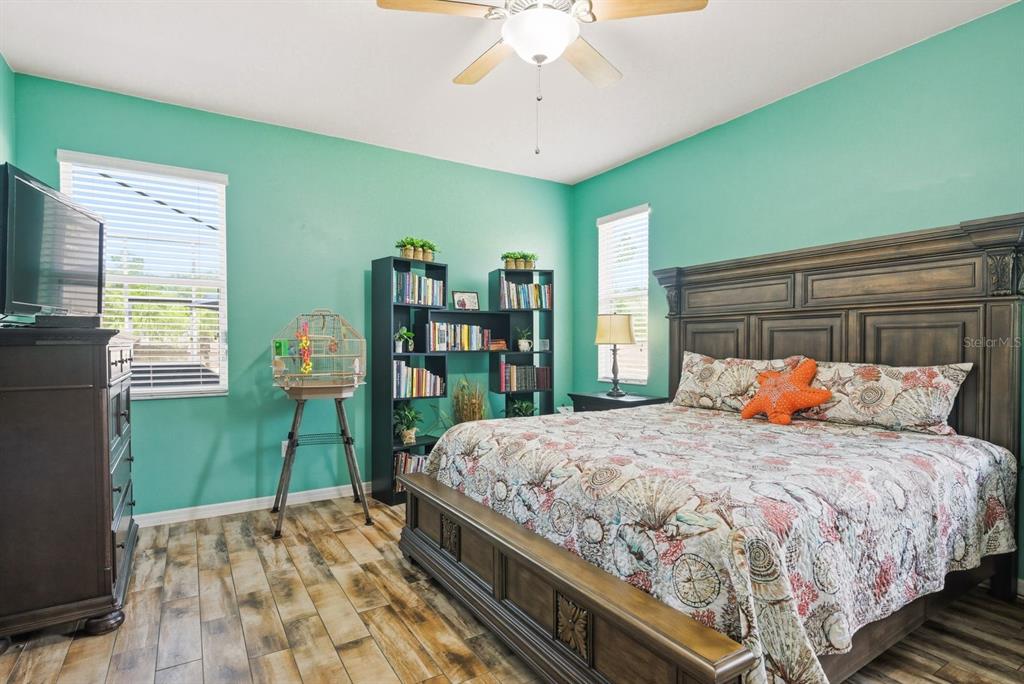 2423 Triggerfish Court Holiday, FL 34691 - Photo 23 of 71 a bedroom with a bed and a bookshelf