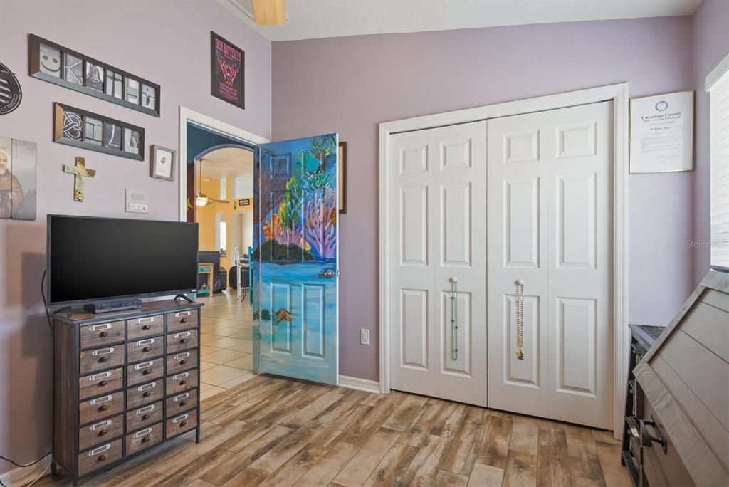 2423 Triggerfish Court Holiday, FL 34691 - Photo 38 of 71 a view of a livingroom with wooden floor and flat screen tv
