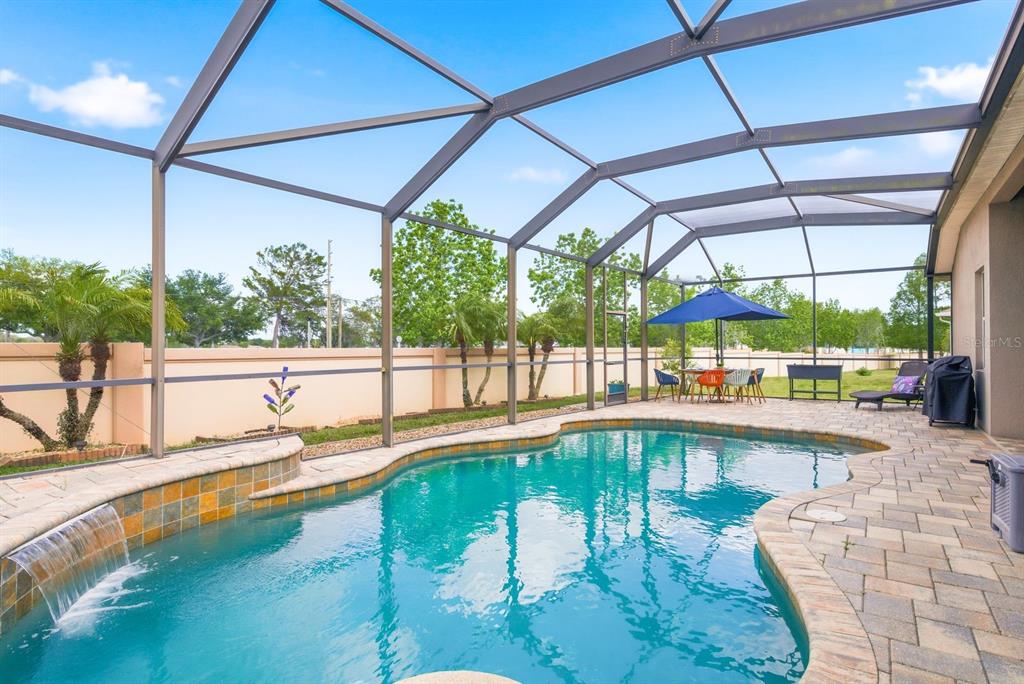 2423 Triggerfish Court Holiday, FL 34691 - Photo 43 of 71 a view of a swimming pool with a porch