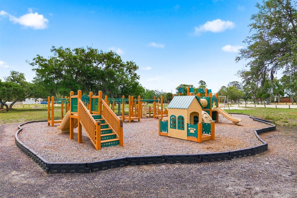 2423 Triggerfish Court Holiday, FL 34691 - Photo 52 of 71 a view of a park with swings
