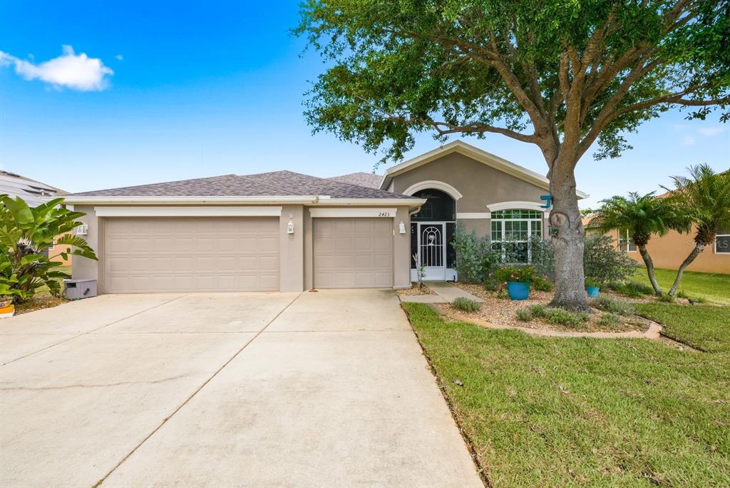 2423 Triggerfish Court Holiday, FL 34691 - Photo 53 of 71 a front view of a house with a yard
