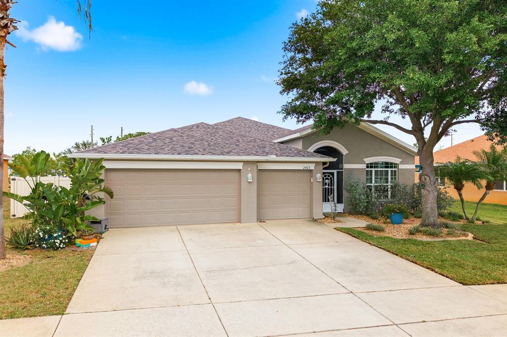 2423 Triggerfish Court Holiday, FL 34691 - Photo 71 of 71 a front view of a house with a yard and garage