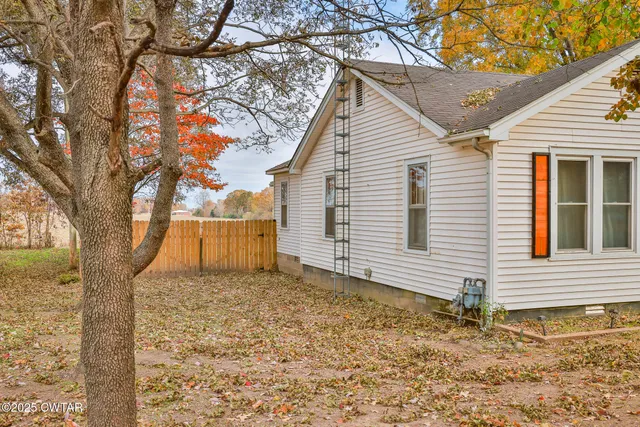 a view of a backyard with a house