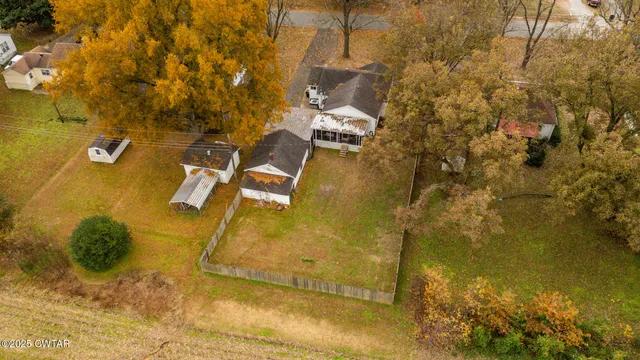 a view of residential houses with swimming pool