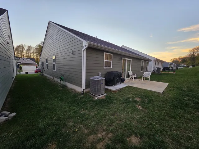 a view of a backyard of the house