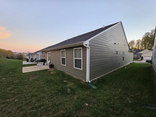 a view of a backyard of the house