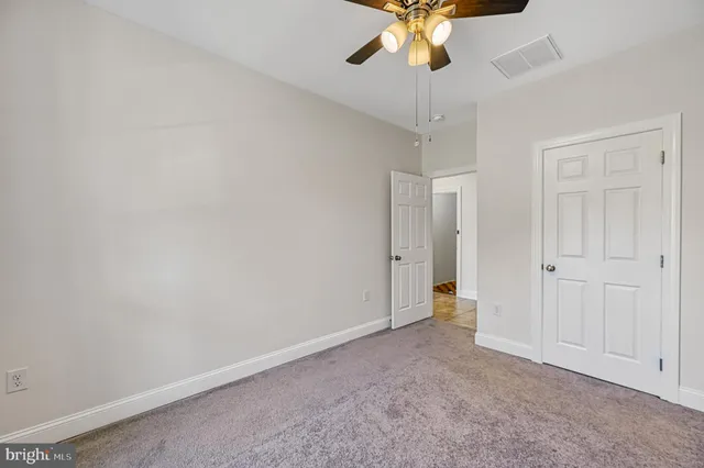 a bathroom with a sink and mirror with bathtub