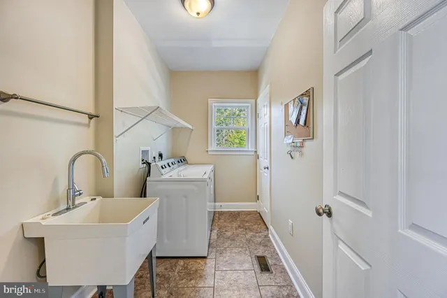 a bathroom with a shower sink vanity and mirror