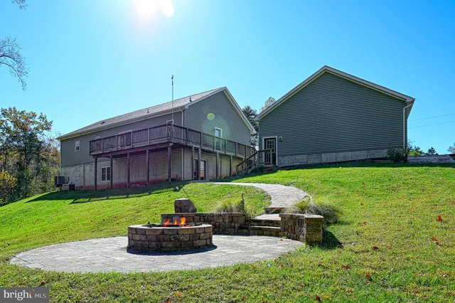 a house that has sitting area in backyard