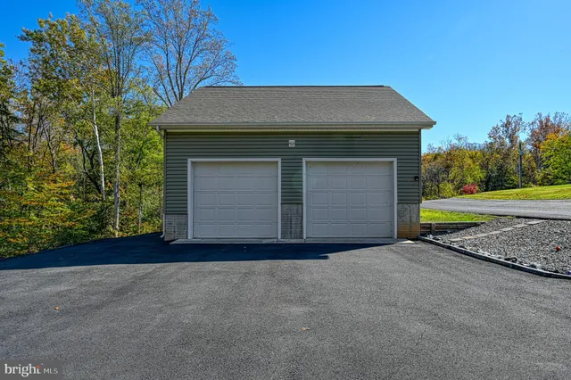 a view of empty room with wooden walls