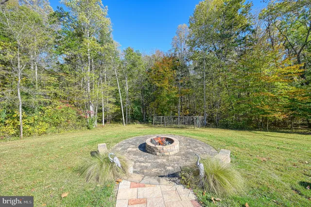 a view of backyard with trampoline