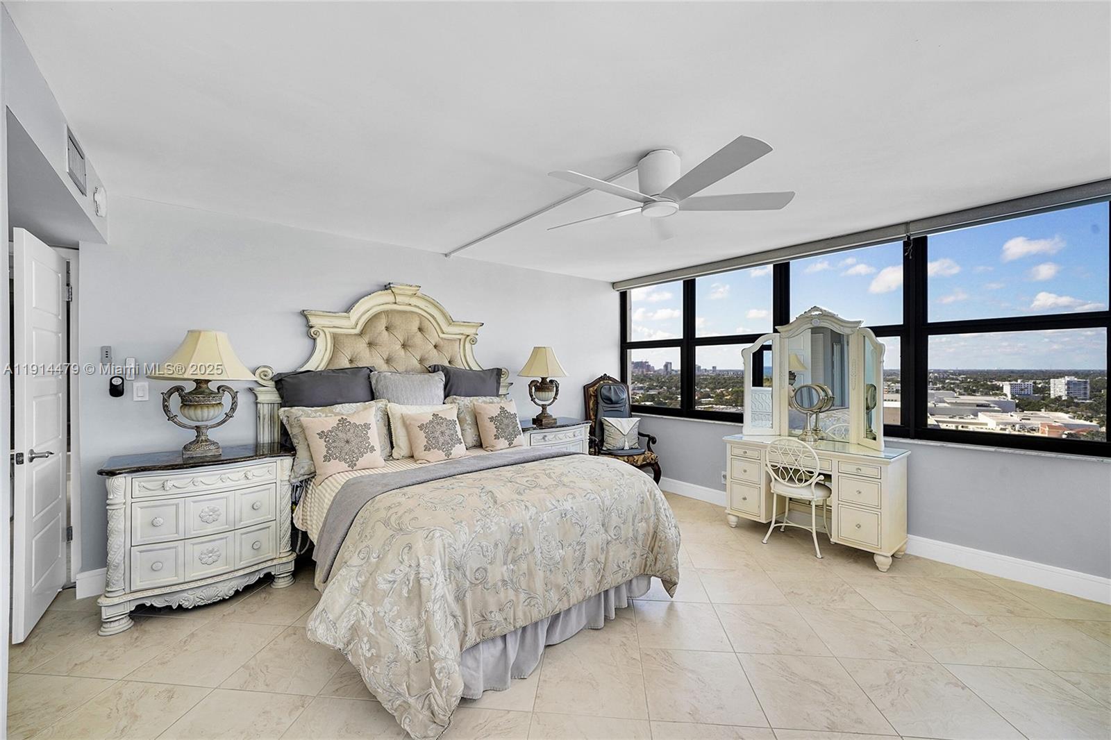 936 Intracoastal Drive, Unit 21A Fort Lauderdale, FL 33304 - Photo 22 of 52 a bedroom with bed and a large window