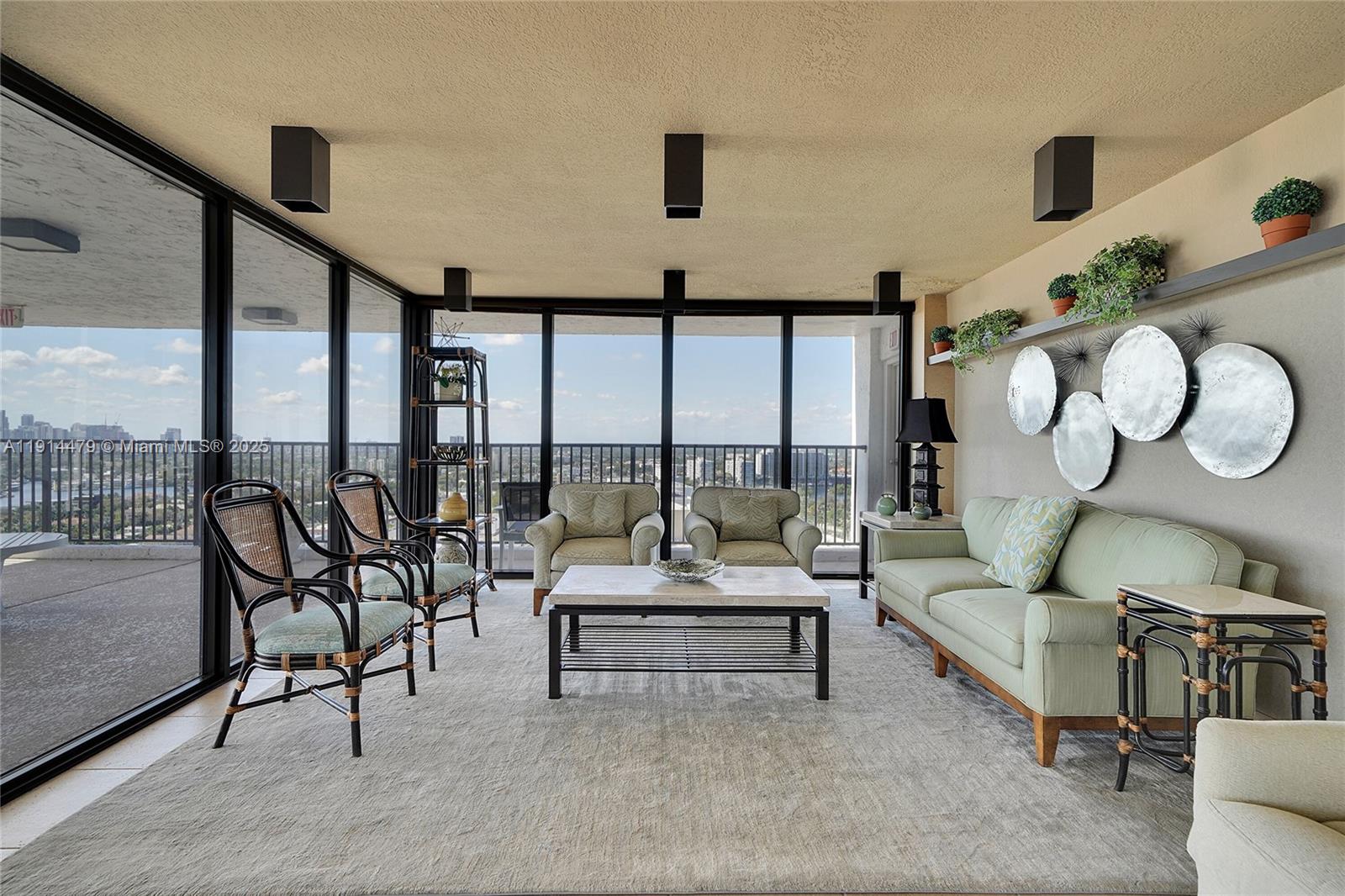 936 Intracoastal Drive, Unit 21A Fort Lauderdale, FL 33304 - Photo 37 of 52 a living room with furniture and a large window