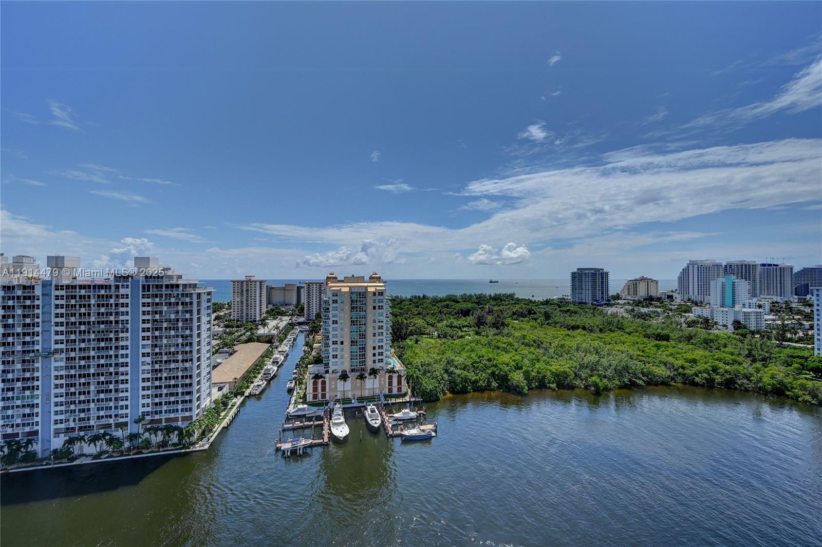 936 Intracoastal Drive, Unit 21A Fort Lauderdale, FL 33304 - Photo 46 of 52 a view of a lake with a bench in roof deck