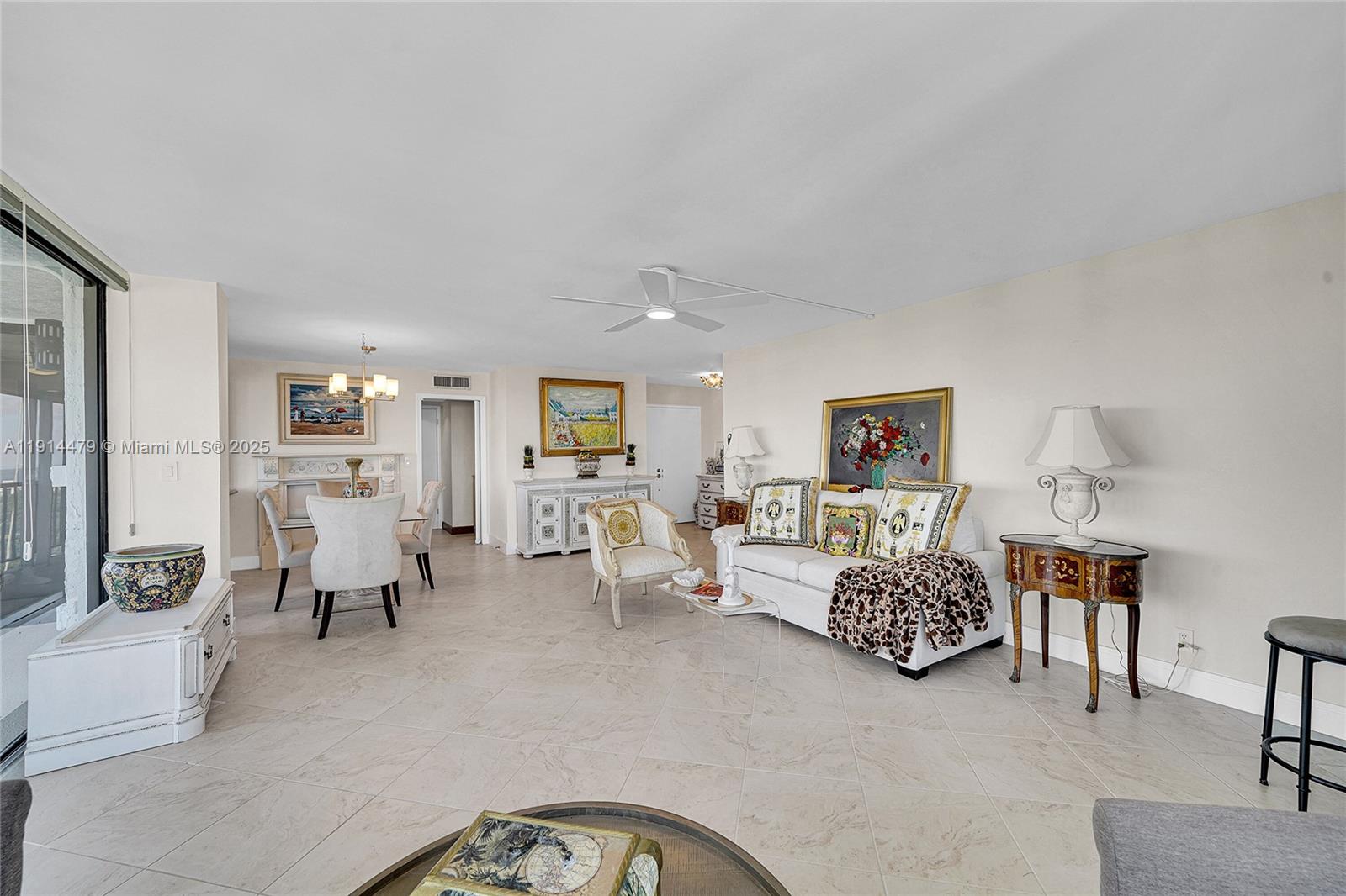 936 Intracoastal Drive, Unit 21A Fort Lauderdale, FL 33304 - Photo 10 of 52 a living room with furniture and a table