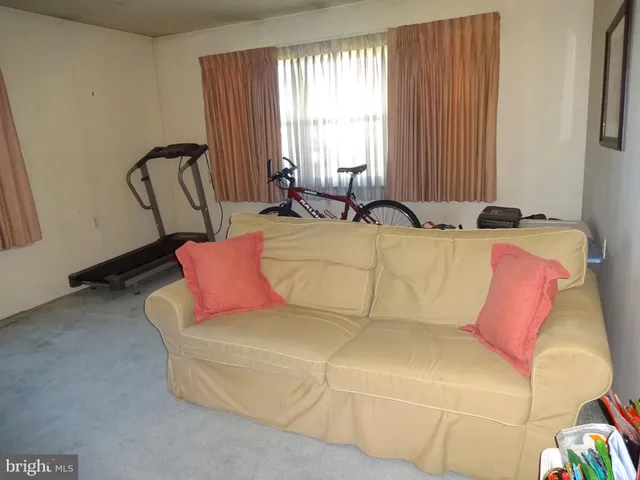 a living room with a couch and furniture