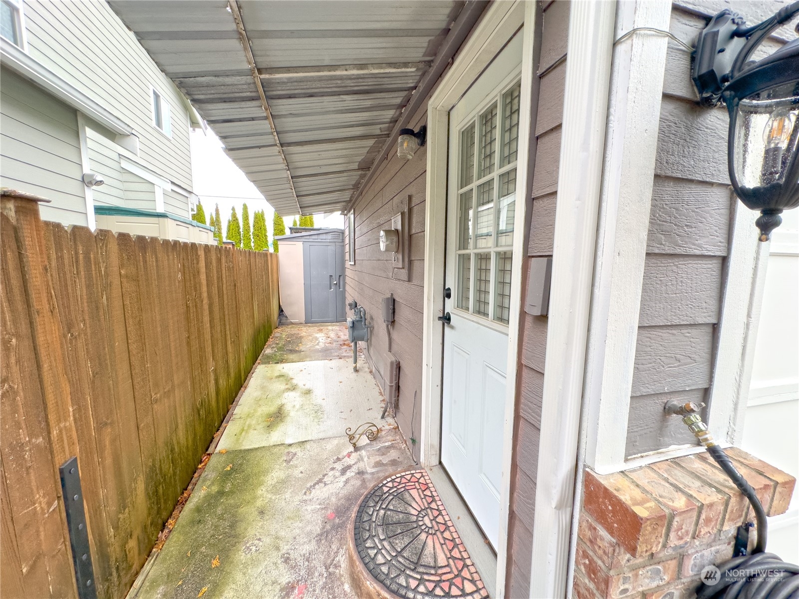 977 Graham Avenue Northeast Renton, WA 98059 - Photo 2 of 10 a view of a porch with wooden floor and stairs