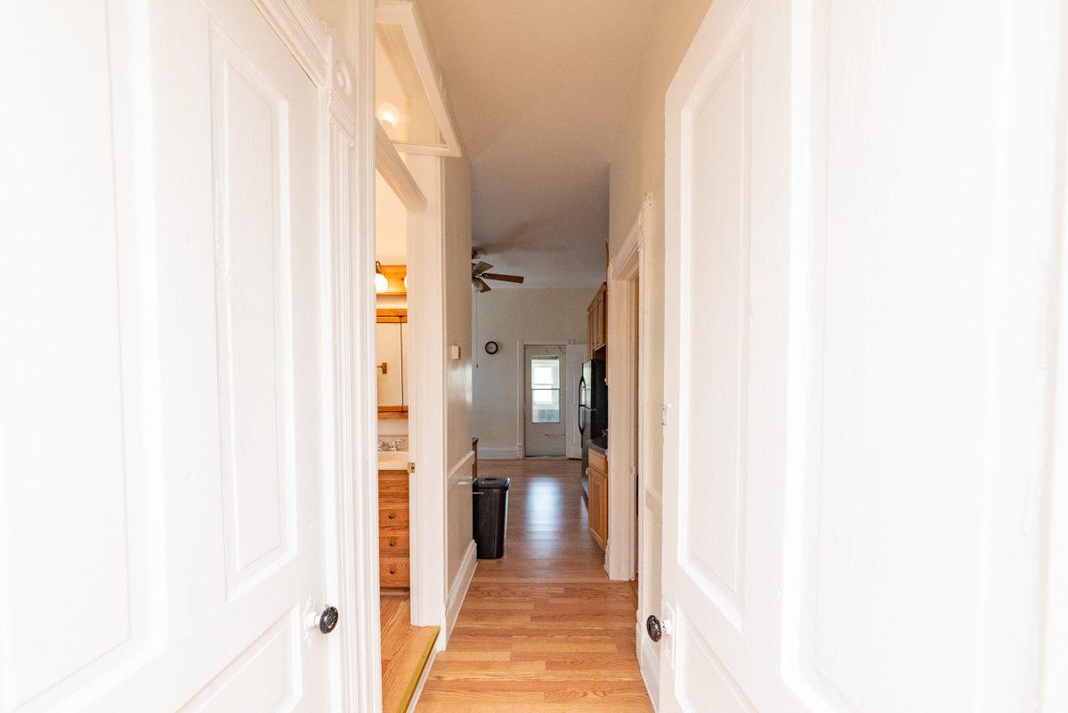 3300 North Racine Avenue, Unit 3 Chicago, IL 60657 - Photo 11 of 17 a view of a hallway with wooden floor