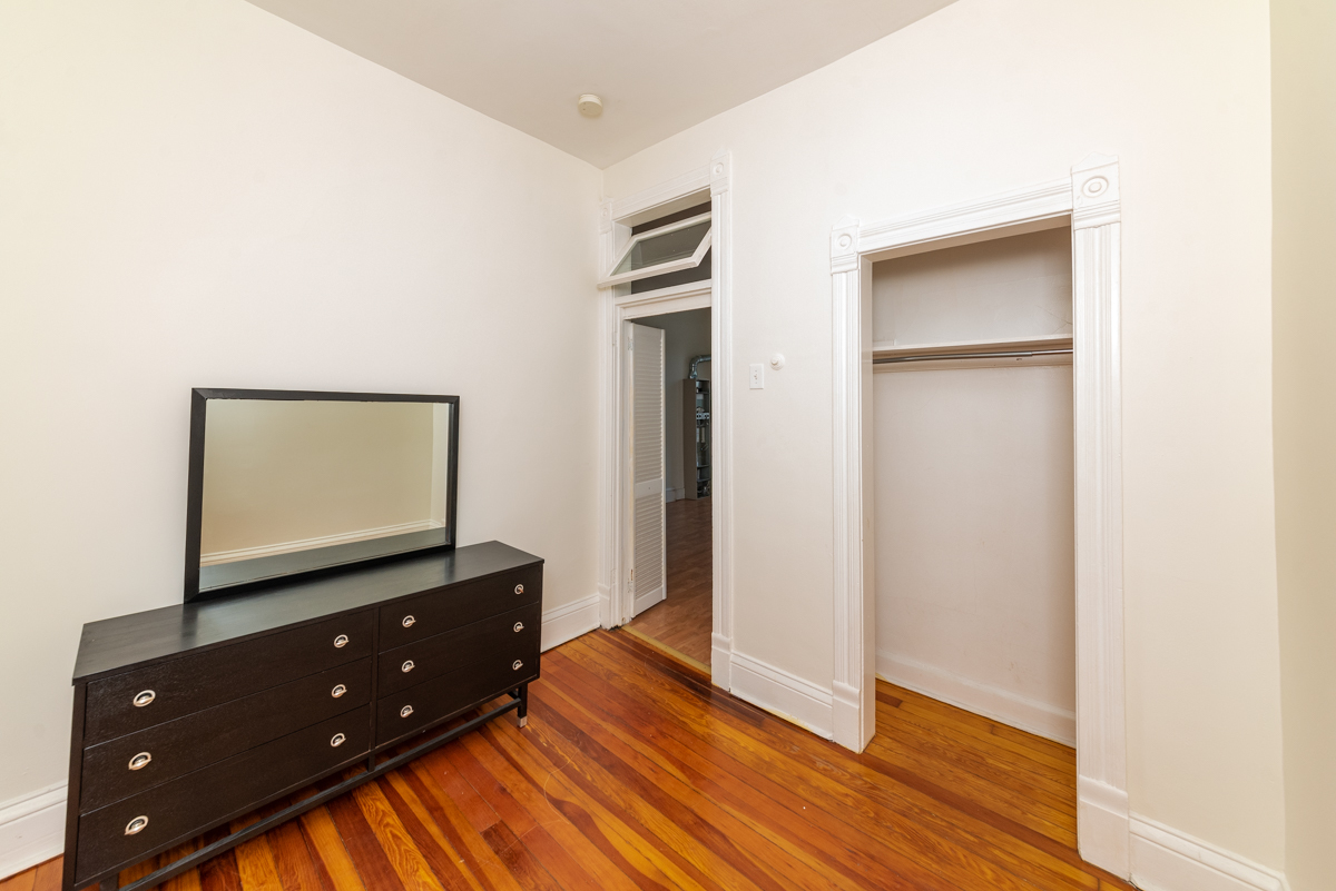 3300 North Racine Avenue, Unit 3 Chicago, IL 60657 - Photo 9 of 17 a room with a dresser and a flat screen tv