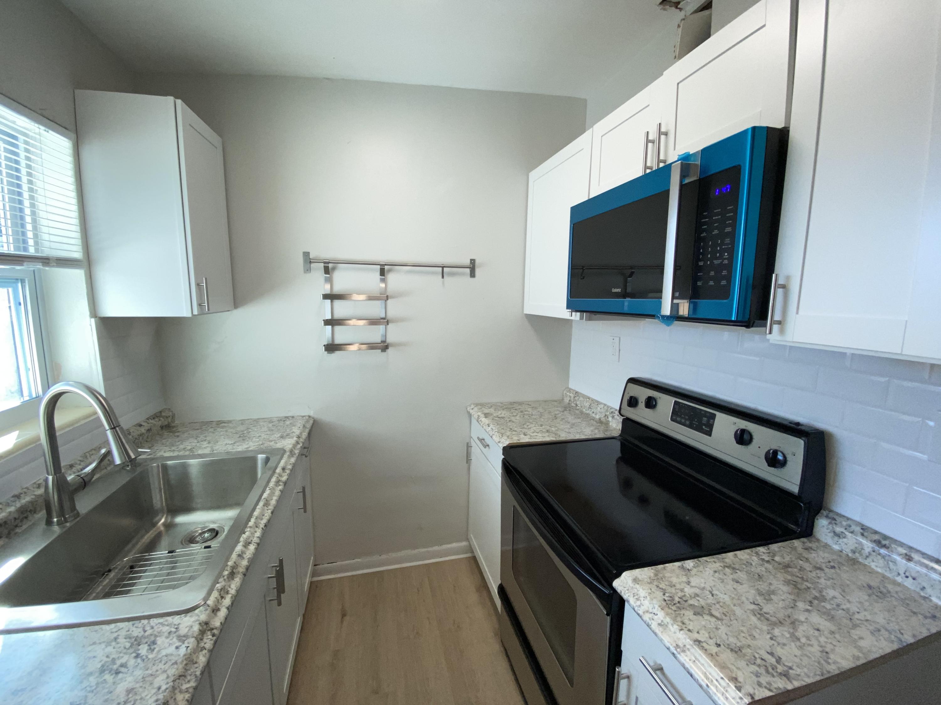 110 Old Spanish Trail Lake Worth, FL 33462 - Photo 1 of 20 Galley Kitchen Area