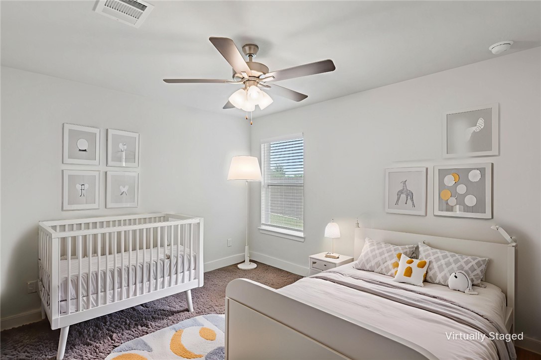 5008 Toscana Loop Bryan, TX 77802 - Photo 21 of 33 a bedroom with furniture and a window