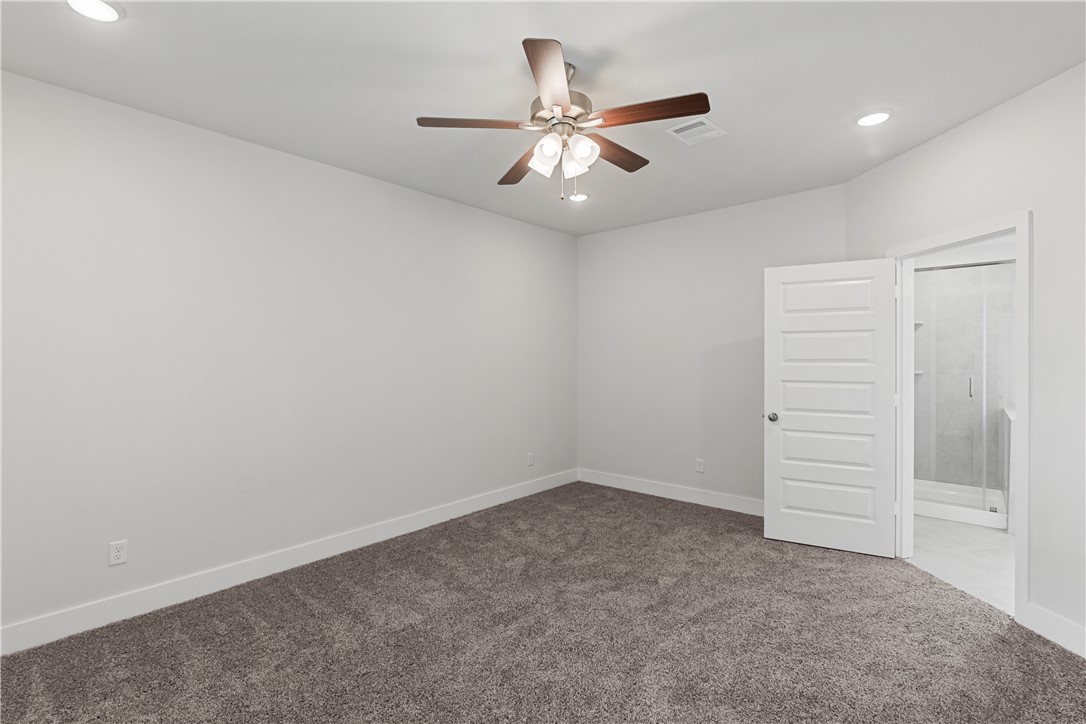 5008 Toscana Loop Bryan, TX 77802 - Photo 23 of 33 an empty room with closet and fan