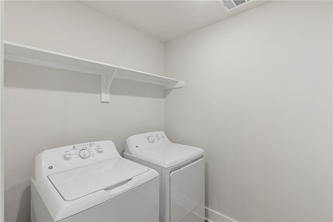 5008 Toscana Loop Bryan, TX 77802 - Photo 29 of 33 a utility room with dryer and washer