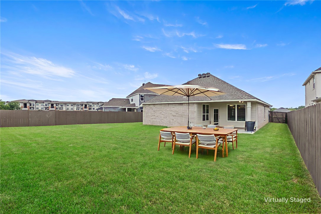 5008 Toscana Loop Bryan, TX 77802 - Photo 33 of 33 a view of a house with a yard