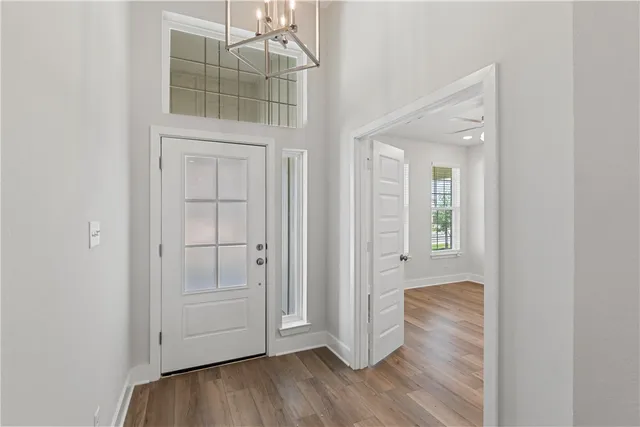 a view of a workspace with furniture and a potted plant