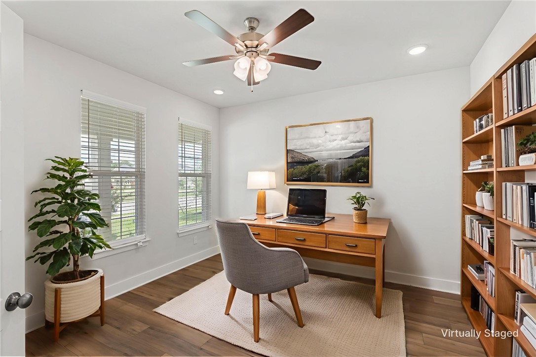 5008 Toscana Loop Bryan, TX 77802 - Photo 5 of 33 a view of a workspace with furniture and a potted plant