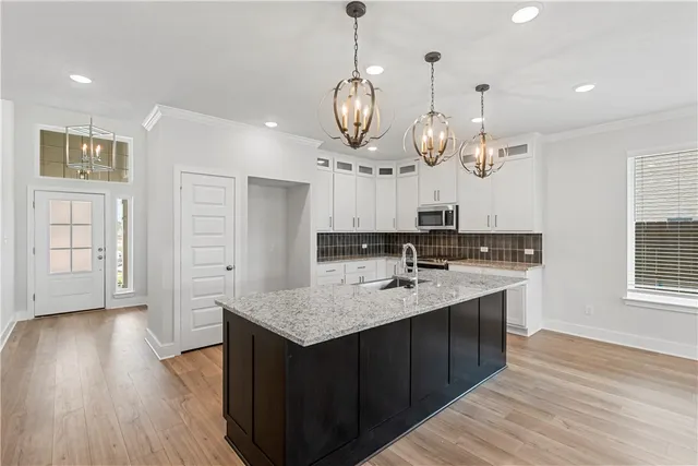 a view of a kitchen with a sink and dishwasher