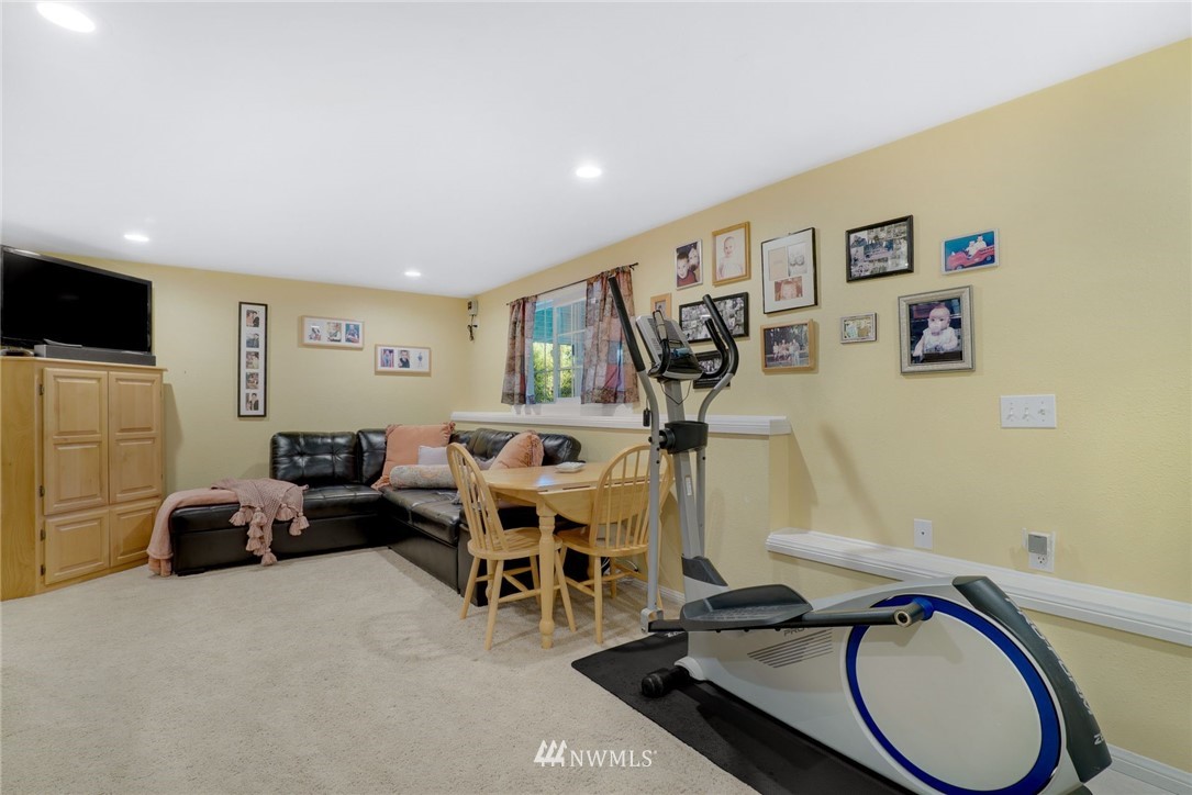 18724 Dubuque Road Snohomish, WA 98290 - Photo 22 of 38 a view of a livingroom with furniture and a flat screen tv