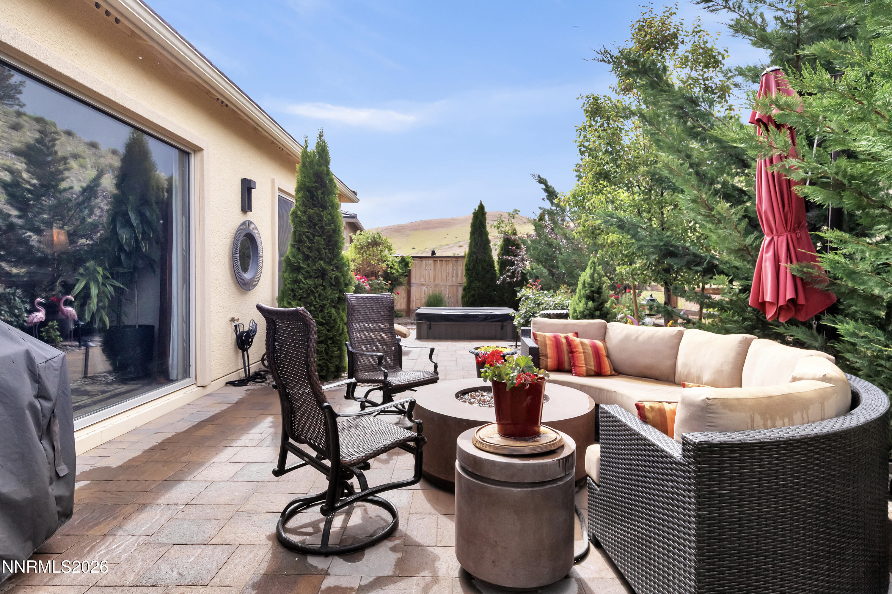 9021 Iron Sky Court Reno, NV 89523 - Photo 34 of 39 a view of a patio with couches chairs and a potted plant