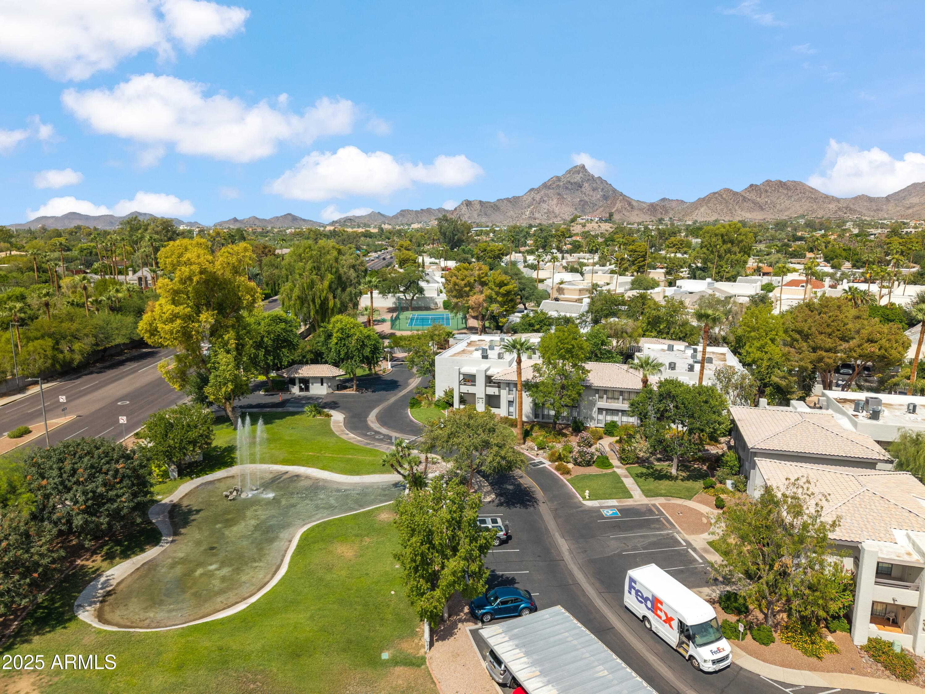 5201 North 24th Street, Unit 206 Phoenix, AZ 85016 - Photo 1 of 39 an aerial view of residential houses with outdoor space and a lake view