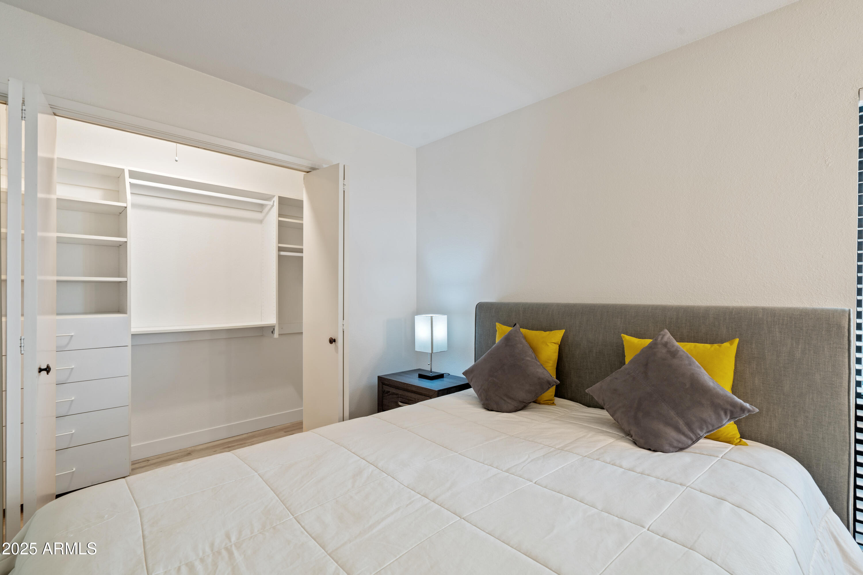 5201 North 24th Street, Unit 206 Phoenix, AZ 85016 - Photo 14 of 39 a bedroom with a bed and window