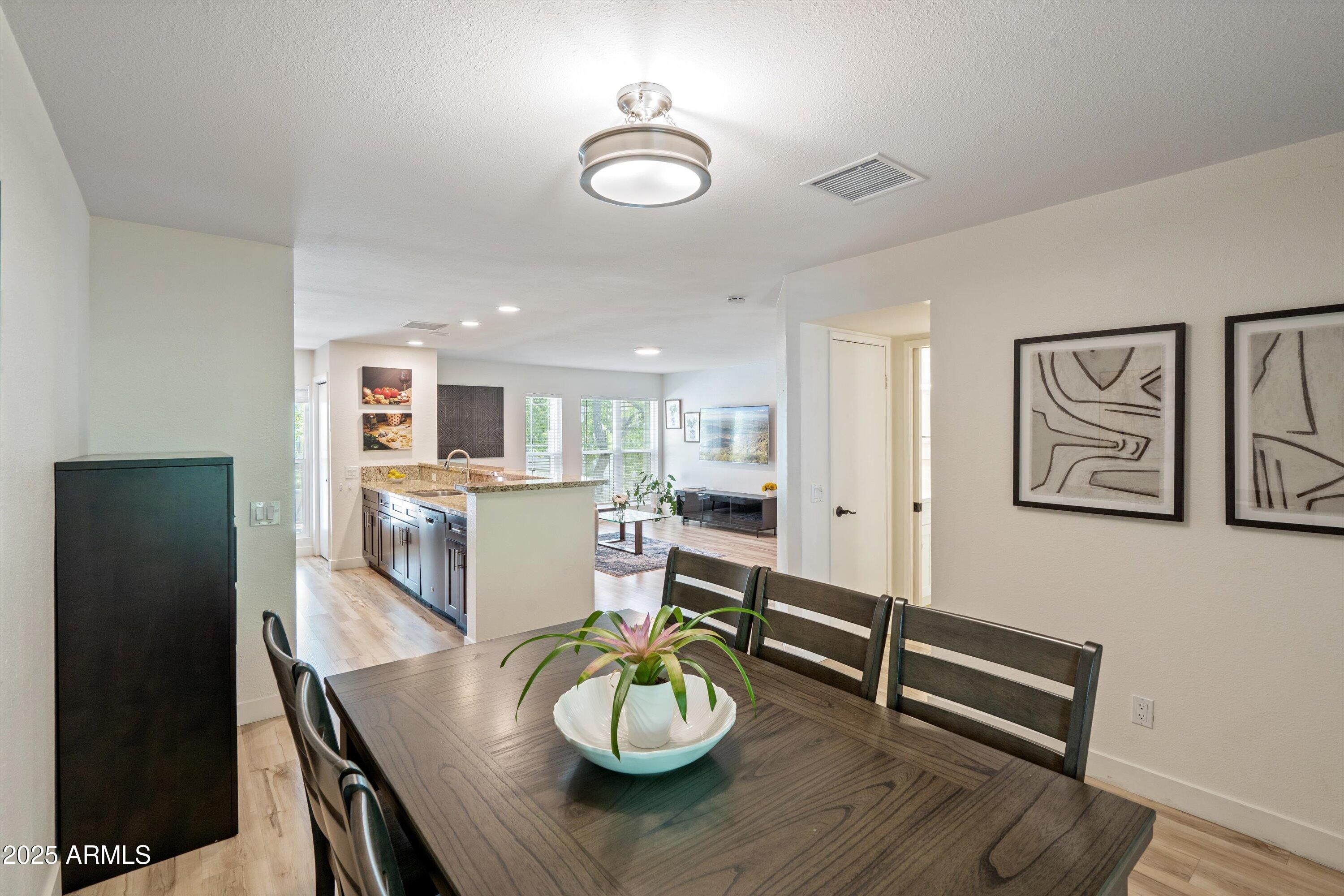 5201 North 24th Street, Unit 206 Phoenix, AZ 85016 - Photo 19 of 39 a living room with furniture and a table