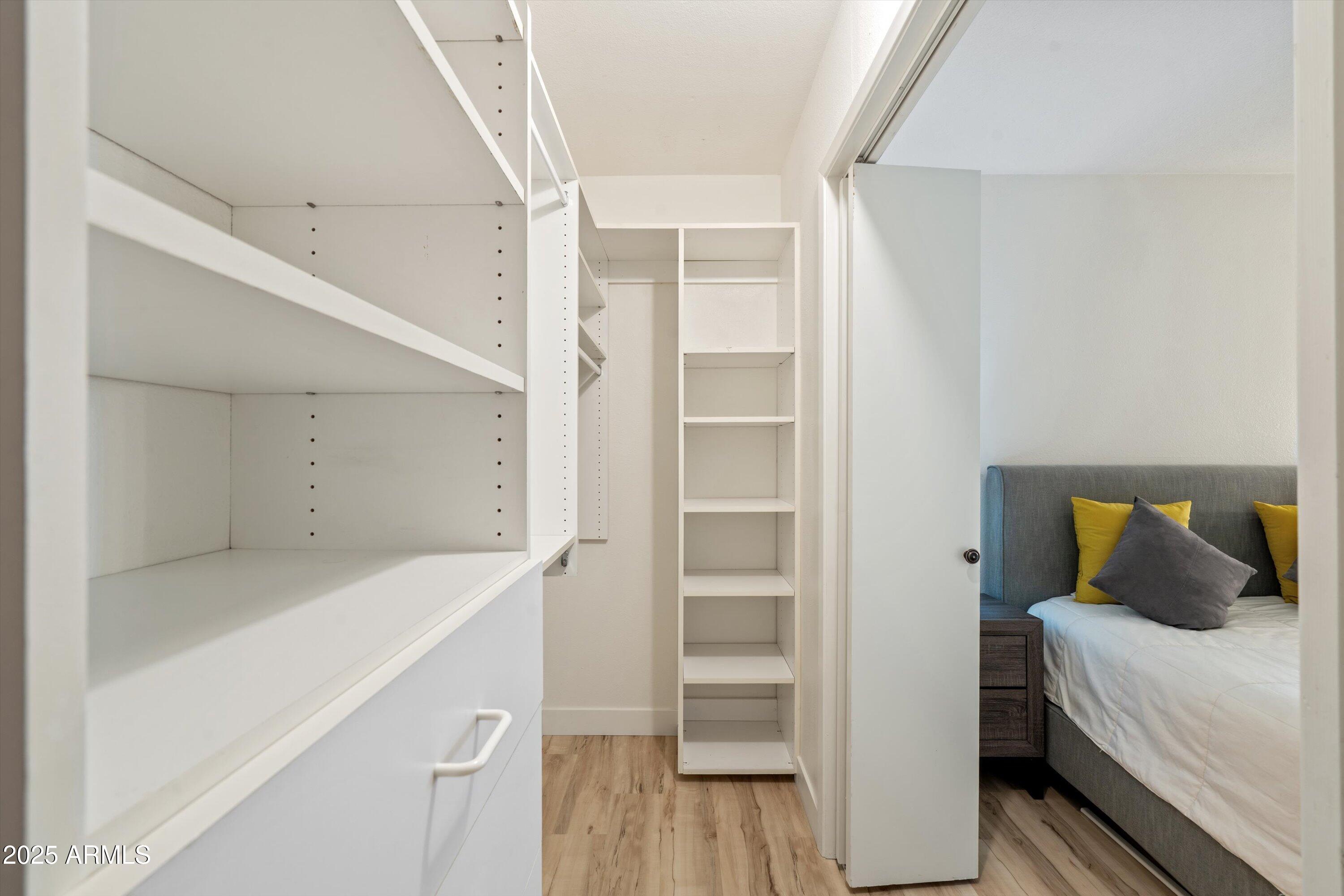 5201 North 24th Street, Unit 206 Phoenix, AZ 85016 - Photo 25 of 39 a bedroom with a bed and a view of closet