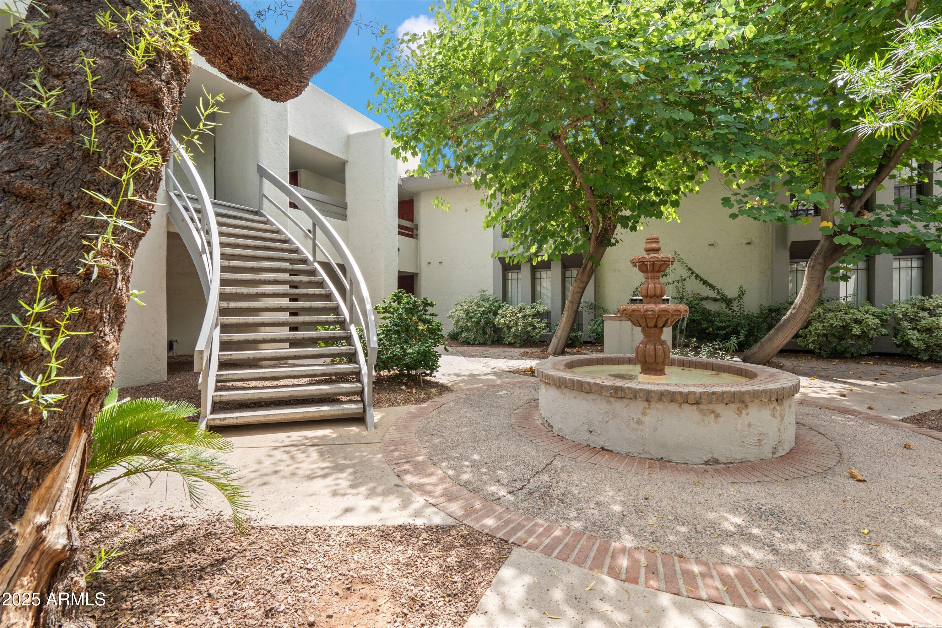 5201 North 24th Street, Unit 206 Phoenix, AZ 85016 - Photo 2 of 39 a view of a house with backyard and sitting area