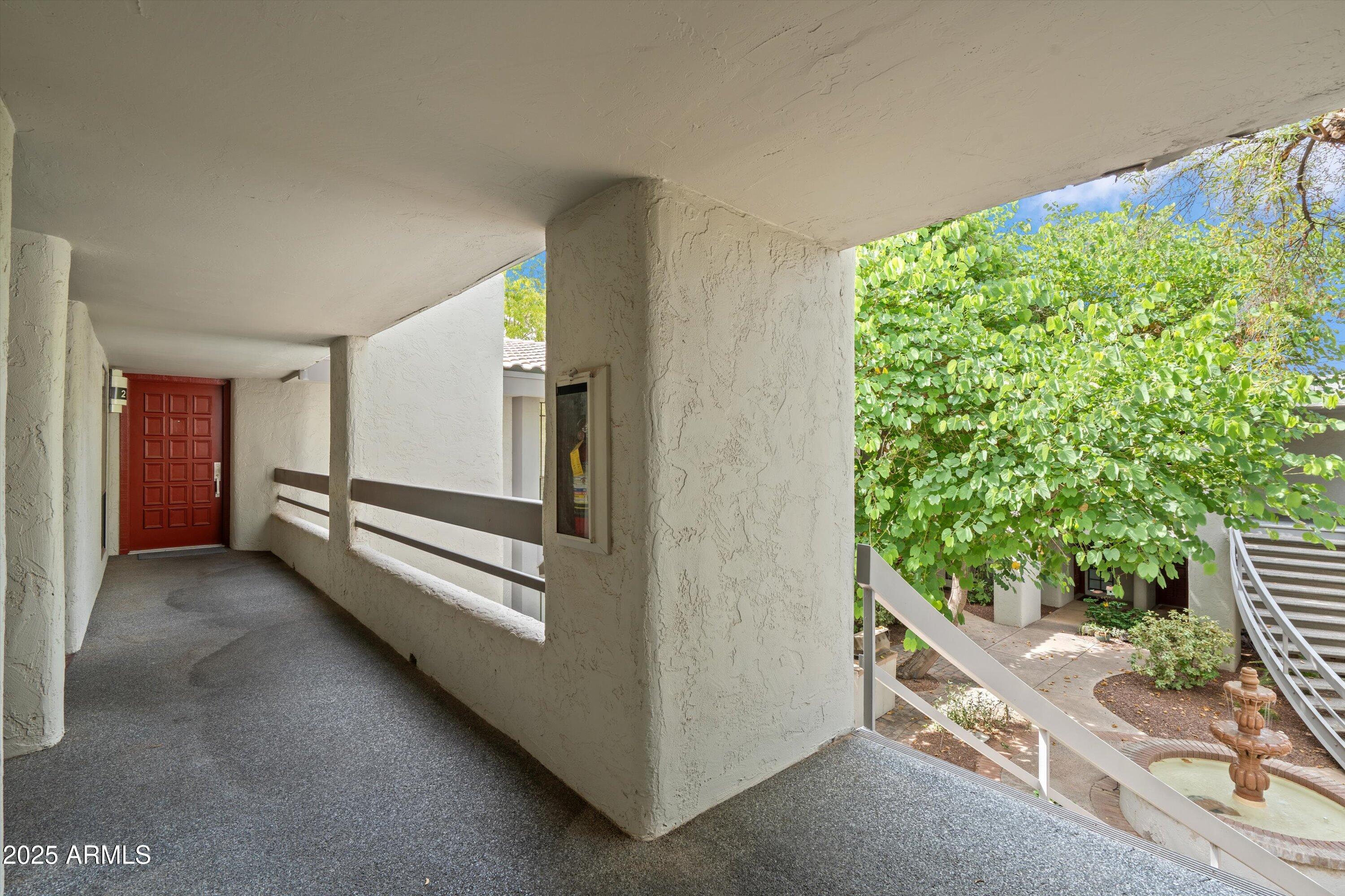 5201 North 24th Street, Unit 206 Phoenix, AZ 85016 - Photo 35 of 39 a view of a hallway with stairs