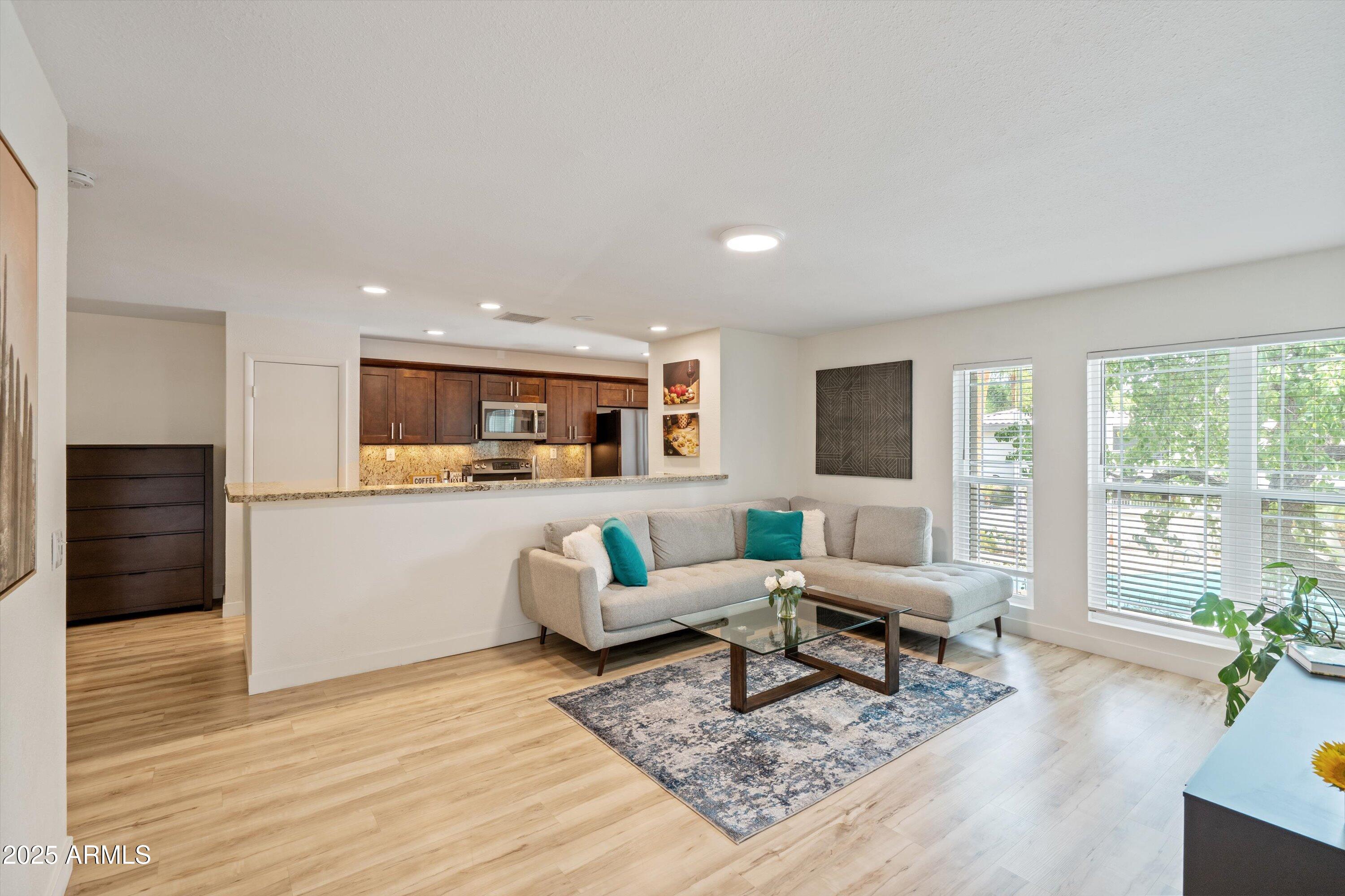 5201 North 24th Street, Unit 206 Phoenix, AZ 85016 - Photo 6 of 39 a living room with furniture and a large window
