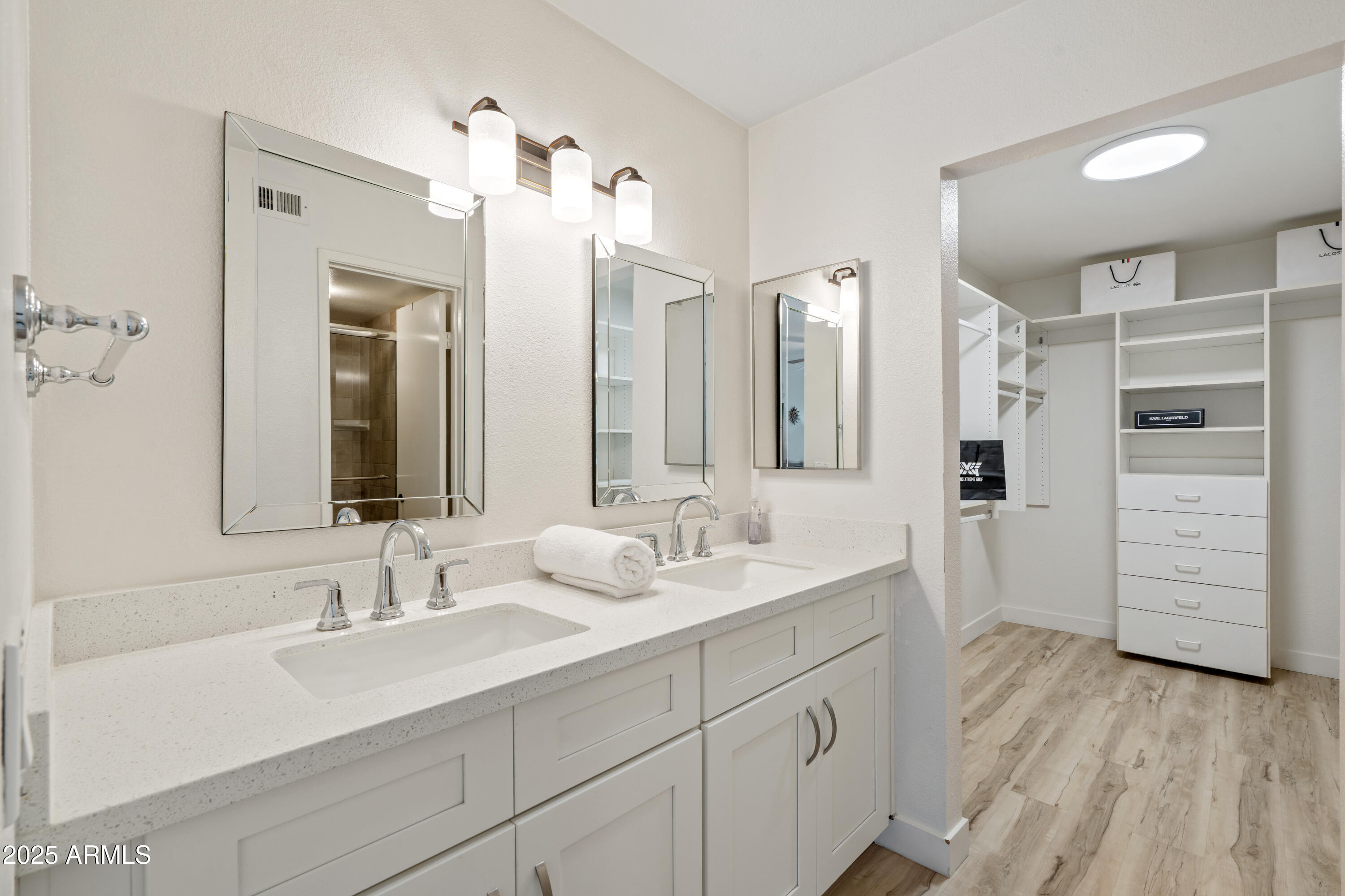 5201 North 24th Street, Unit 206 Phoenix, AZ 85016 - Photo 8 of 39 a bathroom with a double vanity sink a mirror and a shower