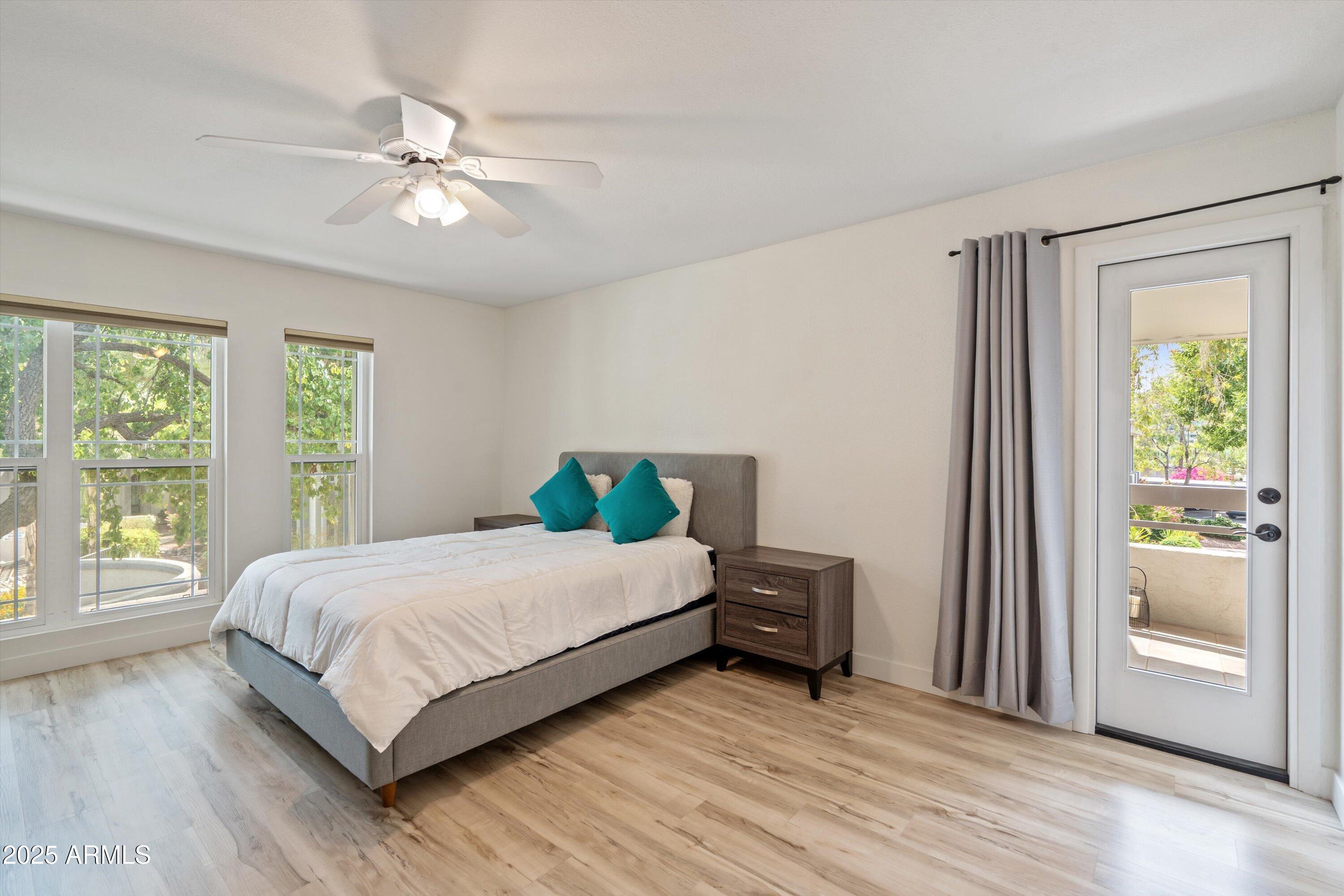 5201 North 24th Street, Unit 206 Phoenix, AZ 85016 - Photo 9 of 39 a bedroom with a bed and a window