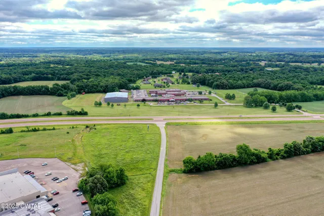 aerial view of a house with outdoor space and seating