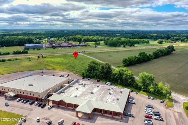 an aerial view of a house with a big yard