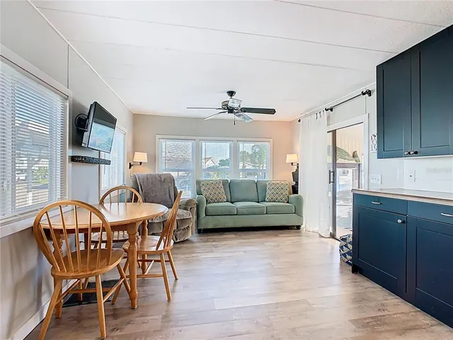 a spacious bathroom with a granite countertop sink and a mirror